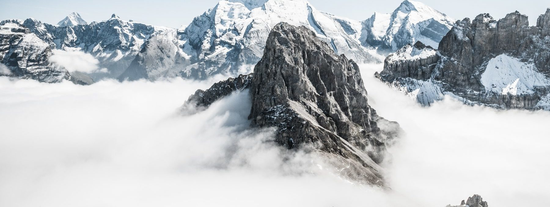 Services Digital Enablement Choose an Experienced Partner visual of snow covered mountains.