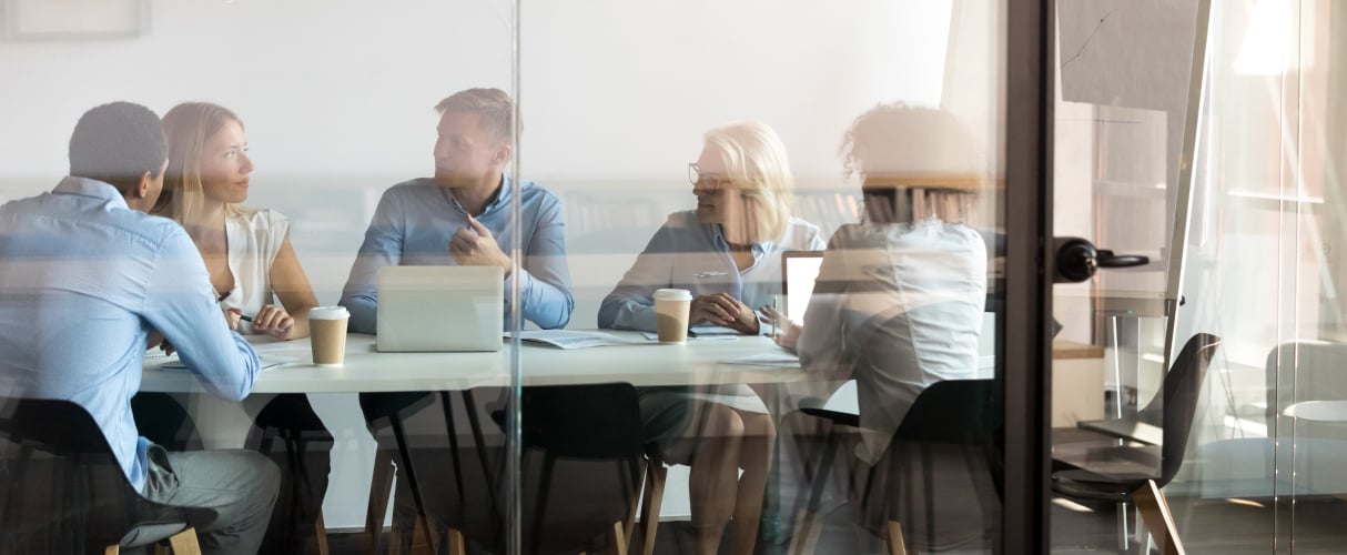 People around a meeting table