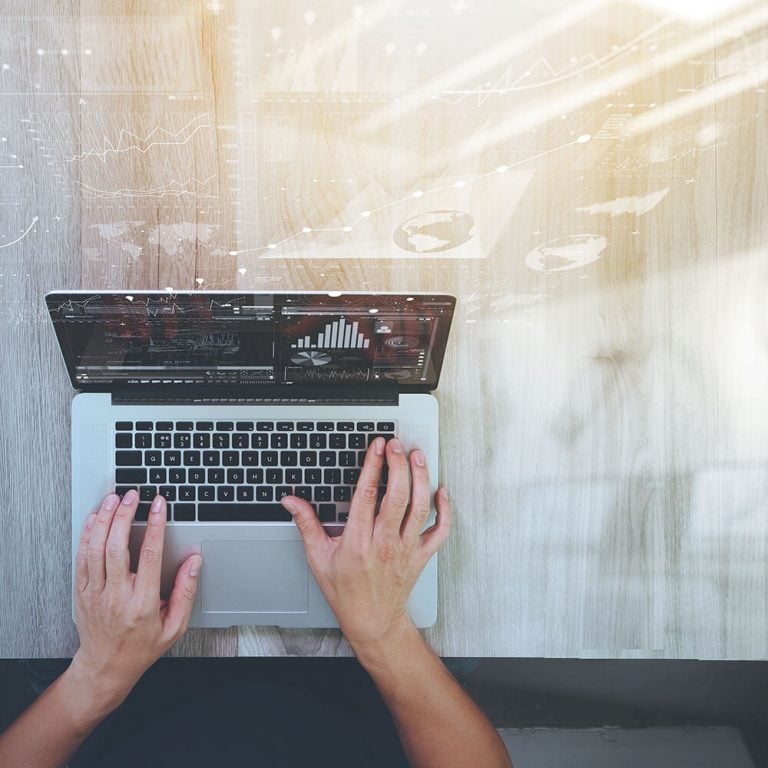 DevOps Cloud Abstract image of hands working on a Macbook