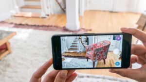 Immersive visual experiences, showed by person using mobile device to virtually position furniture in their room