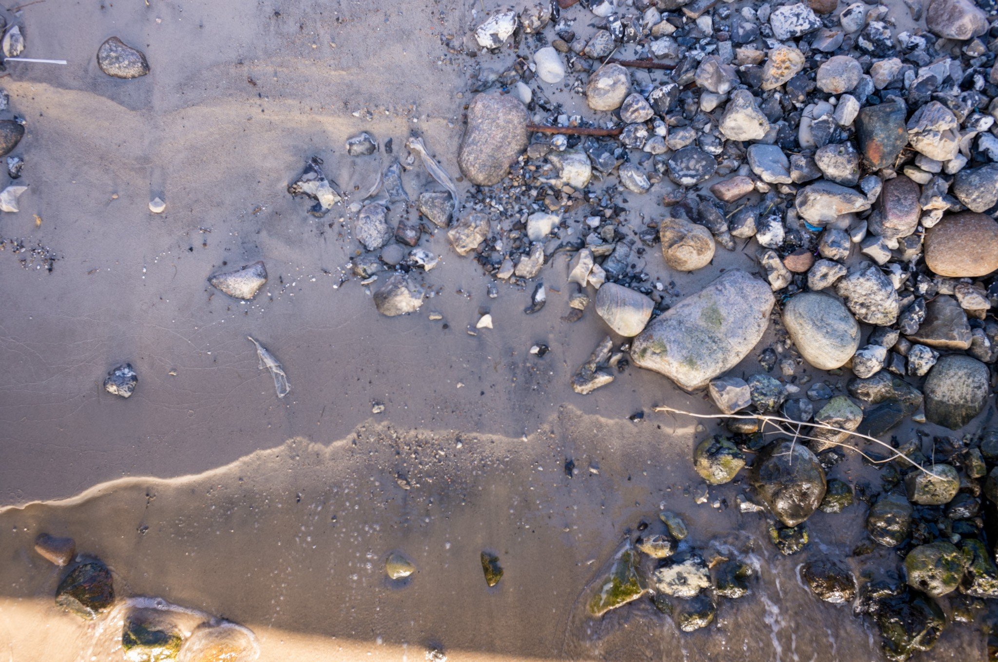 Image of water and rocks on a beach
