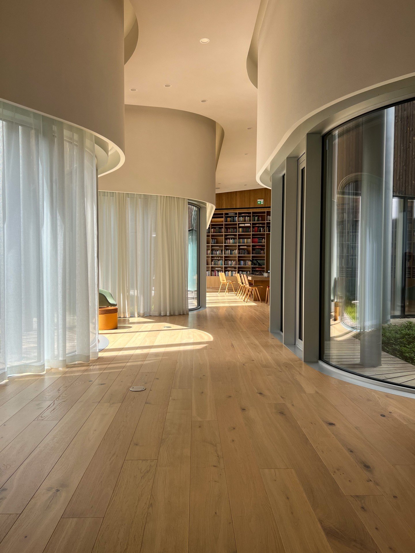 Image of light-filled library or office.