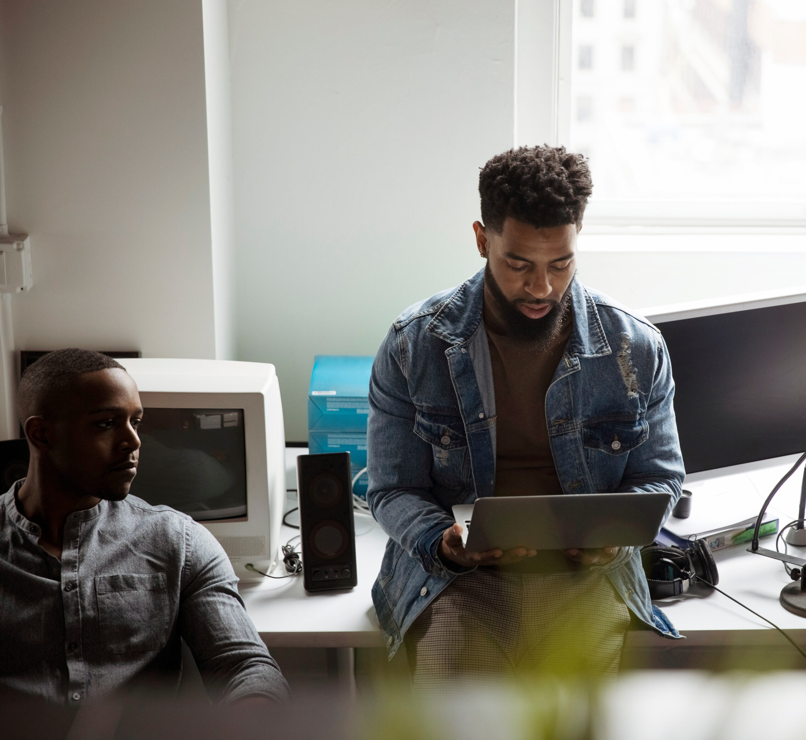 Two men working in an office environment.