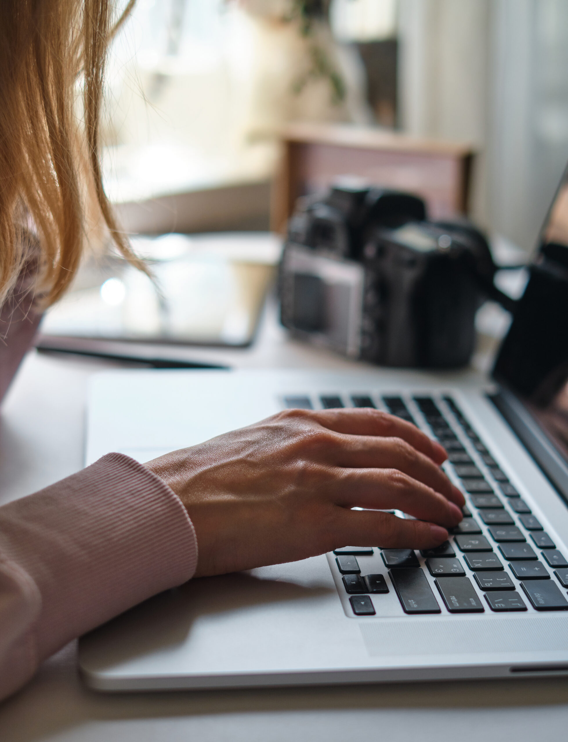 Woman working on laptop.