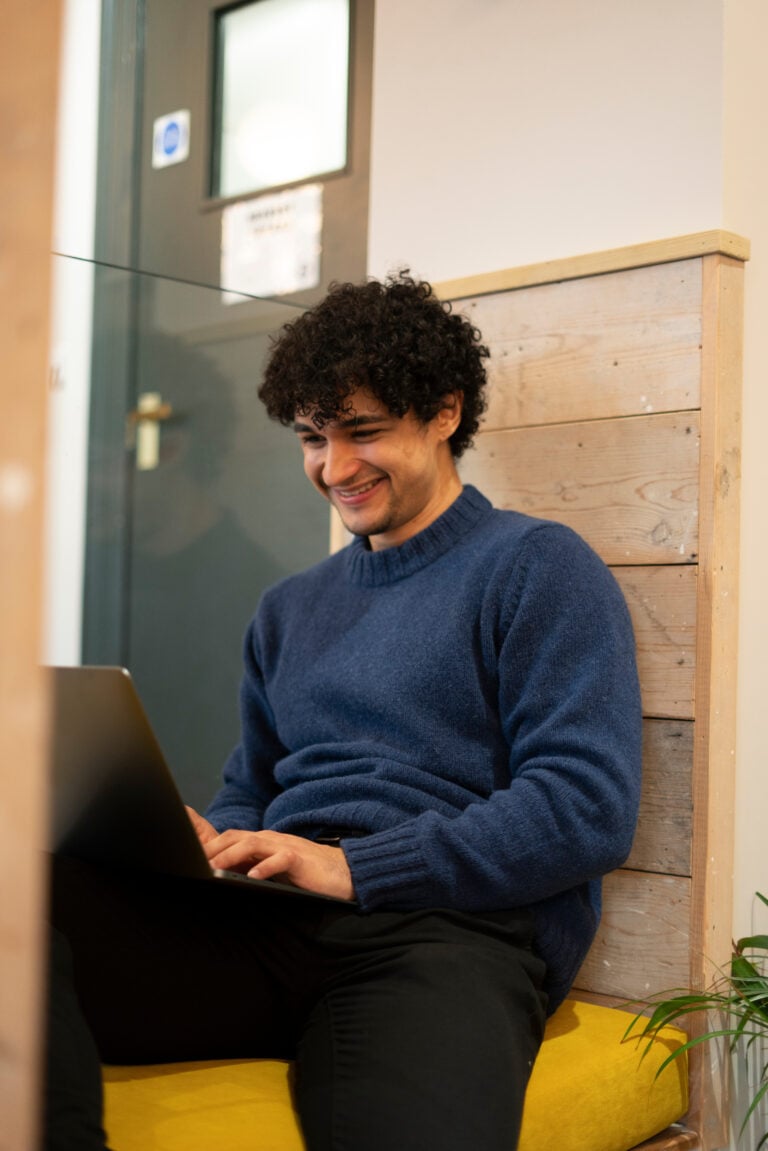 Man working on laptop.