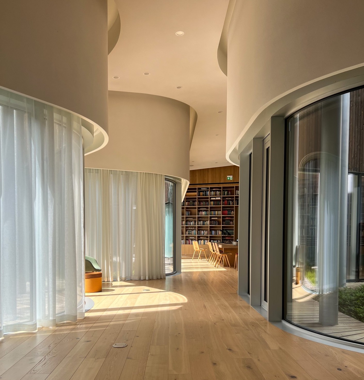 A light and airy empty office space with floor to ceiling windows.