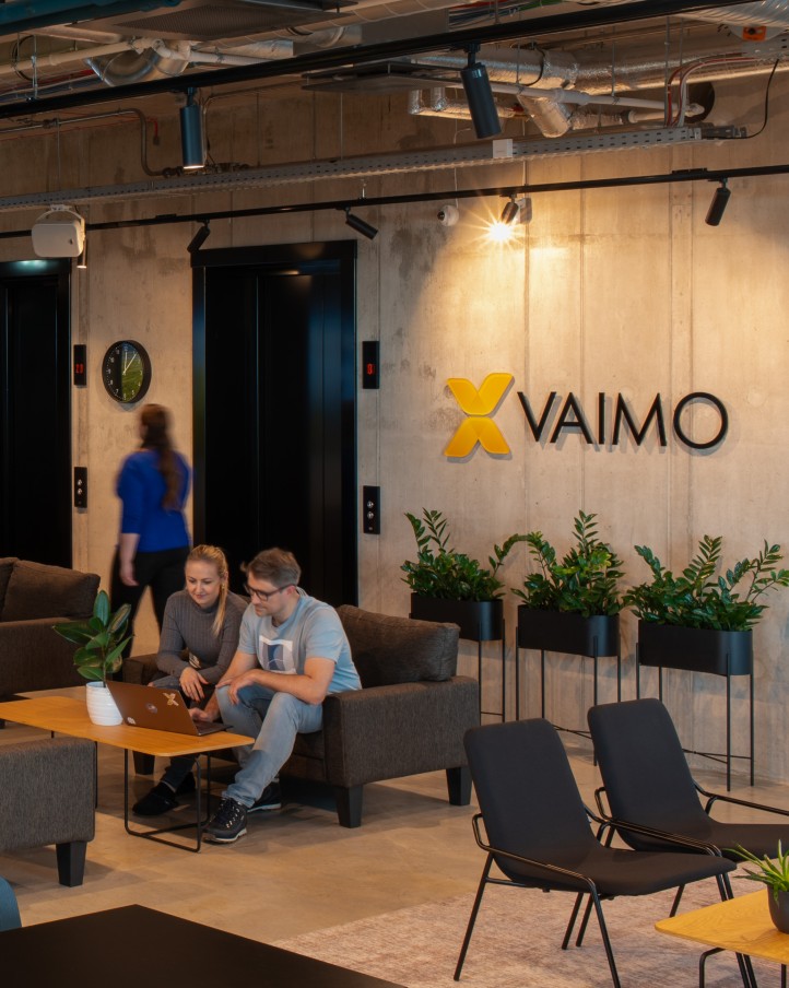 Image of Vaimo employees sitting together in a Vaimo office