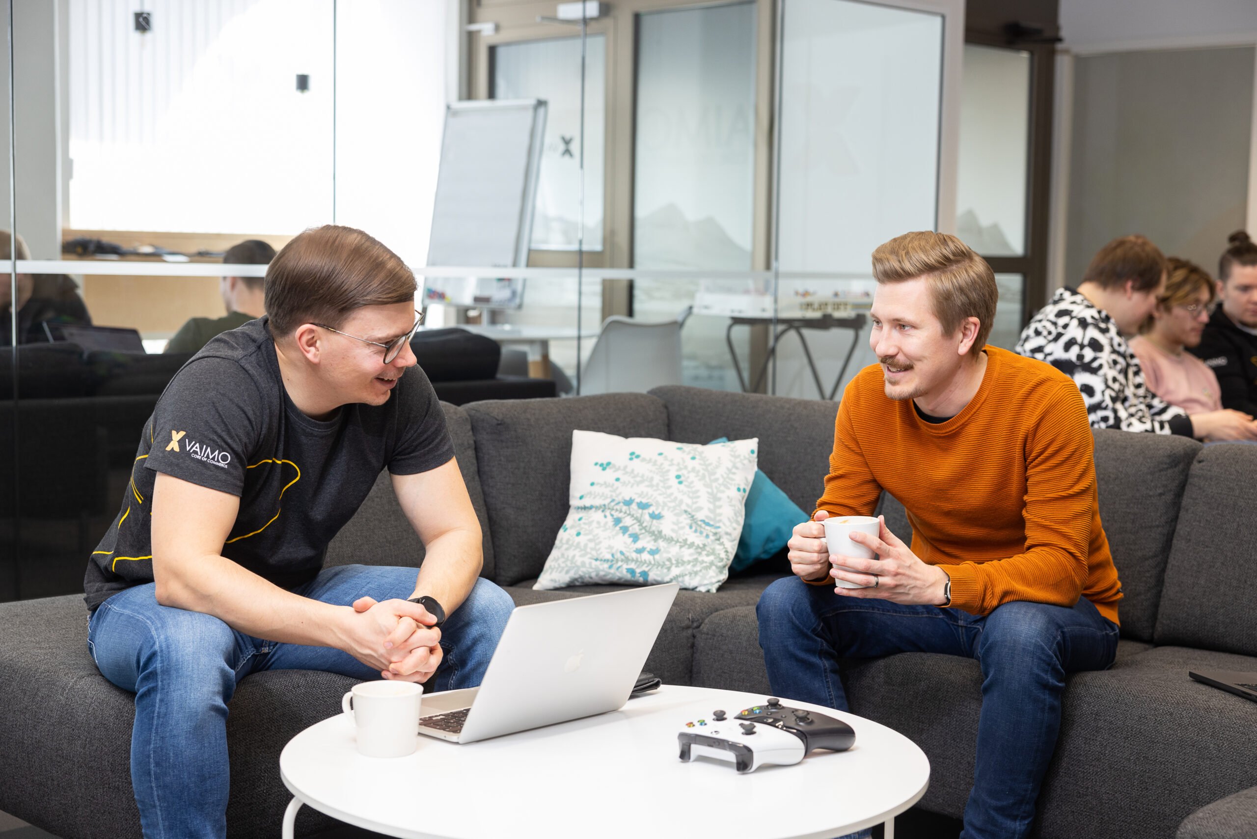 Image of Vaimo employees sitting on couch together