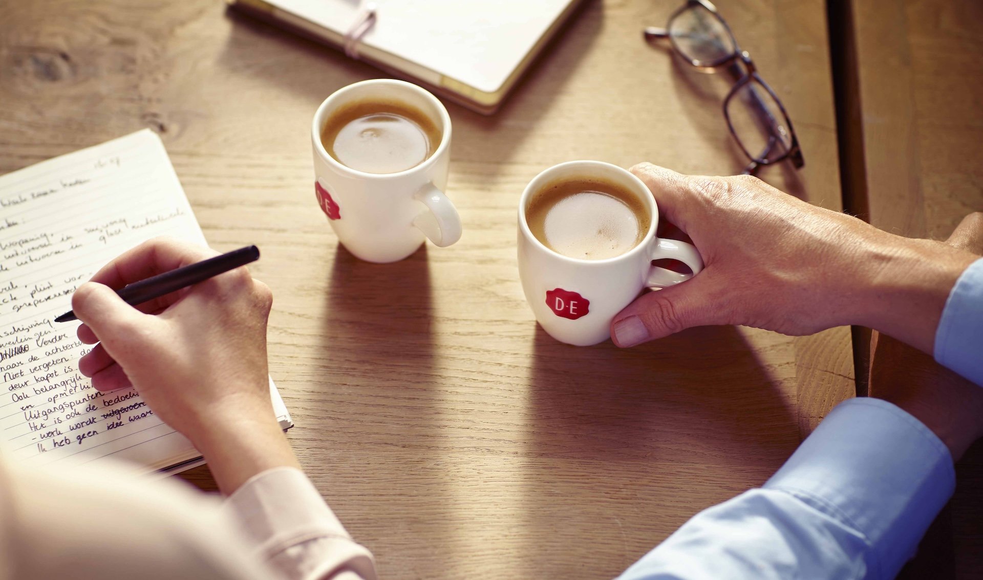 Two cups of coffee on a table
