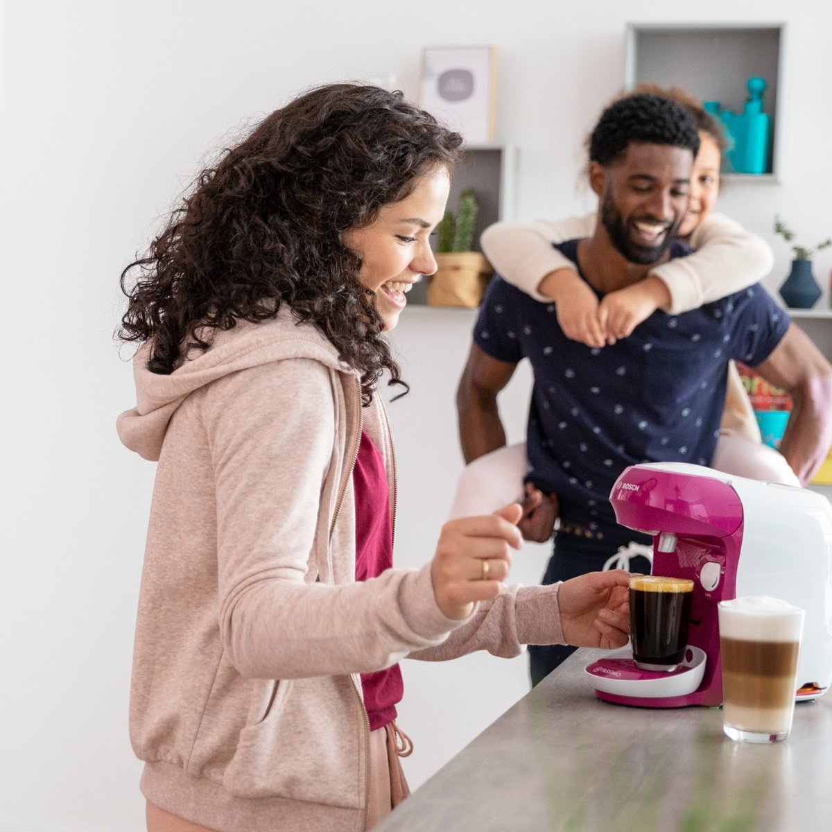 Family using coffee machine
